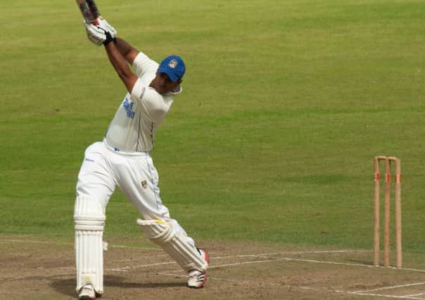 Kamran Sajid smashes a 'four' for Donemana during Sunday's match against Coleraine. INLS3313-214KM