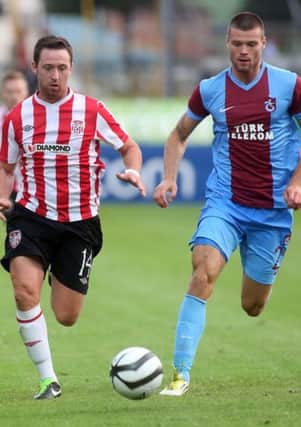 Derry City's Paddy Kavanagh is chased down by Sunderland's latest addition Ondrej Celustka, during their recent Europa League tie against Trabzonspor, at the Brandywell.