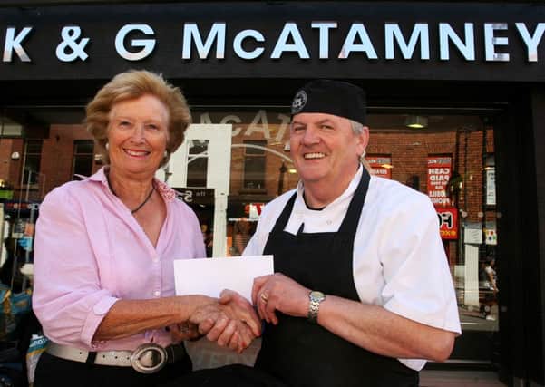 Mary Kearney, lady captain of Ballymena Golf Club, receives sponsorship from Kieran McAtamney, of K&G McAtamney. INBT32-227AC