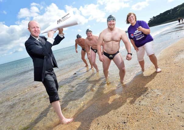 Full Speedo Ahead...Local relay swimming team (l-r) Paul McCambridge, Gerry Meehan and Ciaran Pollock are almost set to take on the challenge of attempting to swim the English Channel. The guys will be joined by Maureen McCoy, who has previously swum the channel solo, when they face the gruelling swim at the end of August. Travelling from Belfast, Lisburn, Hillsborough and Newry, the team will be attempting the swim in aid of Northern Irelands Children Hospice. The team are pictured with Francis Cullen from team sponsors Mercury Security Management and Ruth Graham from NI Childrens Hospice. 
To sponsor Gerry and the team and support NI Childrens Hospice, make a donation at www.justgiving.com/gerrys-dip.