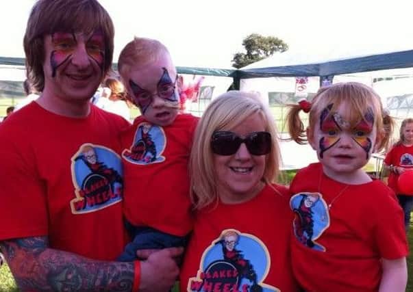 Blake and his sister Pixie with mum Christine and dad Andrew.