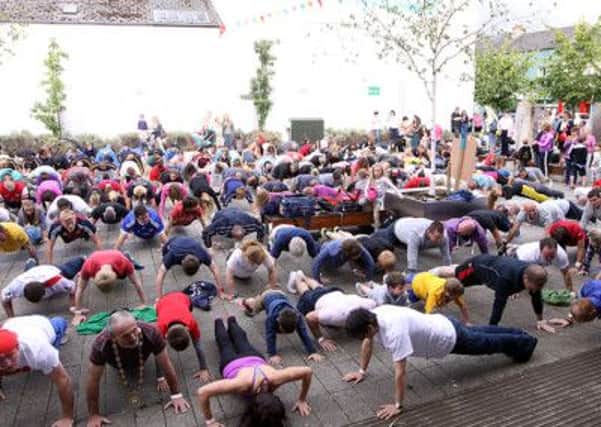 The record breakers take part in the Limavady 400 push up record breaking event. INLV3113-183KDR