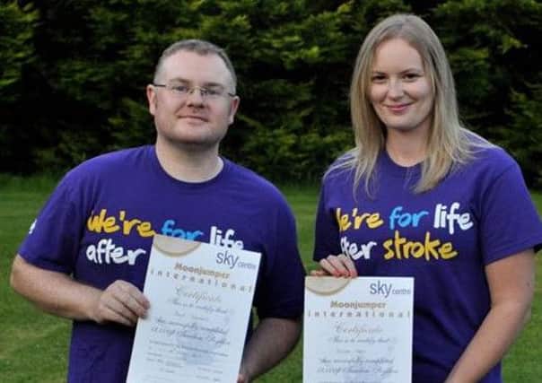 Grace Weir and Paul Stewart of Stealth Translations Ltd after their charity abseil and skydive. INLT 34-600-CON