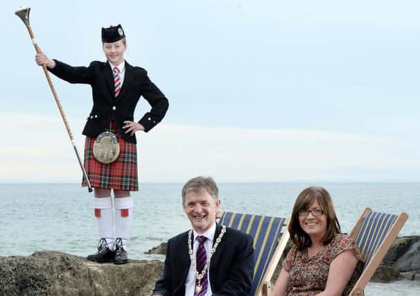 Deputy Mayor of Coleraine Borough Council, Councillor Mark Fielding who will also be acting as Chieftain during the event, with co-sponsor representative Annette Deighan of Causeway Chamber, and Laura Abraham, Drum Major with Seven Towers Pipe Band. INCR34-135