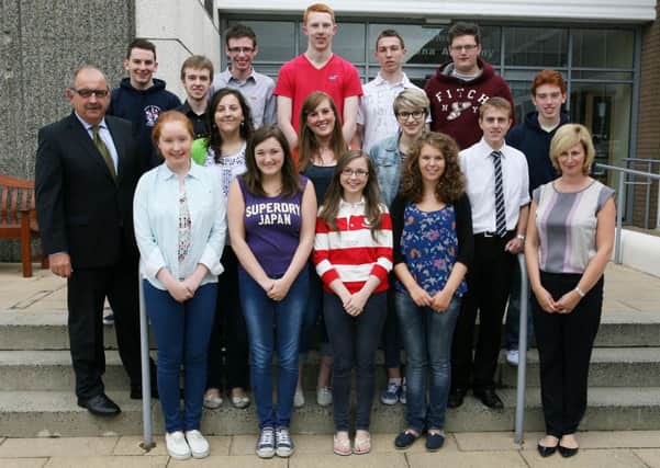 Students from Ballymena Academy who achieved three A's or more in their recent A Level exams are pictured Mr. R. Hassard (principal) and Mrs. A. McDonald (head of year 14). INBT34-228AC