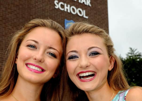 Delighted...St. Mary's Grammar school students twine Maria and Catherine Tennyson, who gained 5A or more in their A Level examination results. INMM3413-114ar.