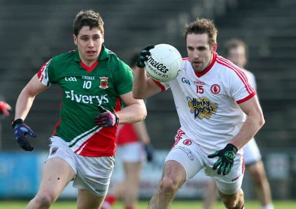 Allianz Football League Division 1, Castlebar, Co. Mayo 10/2/2103 Mayo vs Tyrone Lee Keegan of Mayo and Mark Donnelly of Tyrone. Mandatory Credit ©INPHO/Mike
Shaughnessy