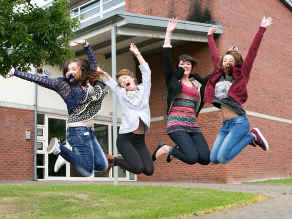 High fliers at Ulidia:  Leah Close, Lauren McIlwrath, Hayley Ferguson and Jane Buckley jump for joy after collecting their results. INCT 34-419-RM