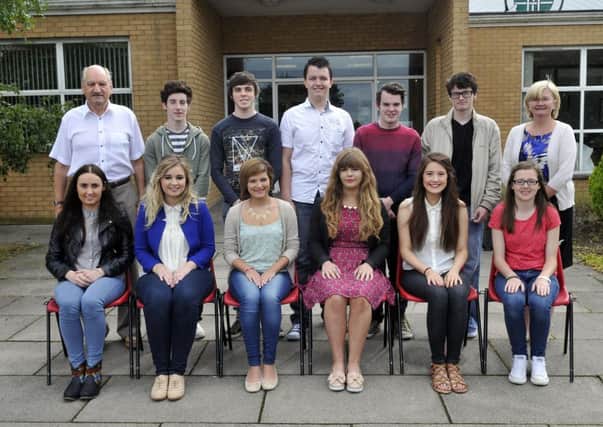 The Lismore Comprehensive School top achievers at A2 Level with Mr Joe Corrigan, principal and Mrs Rosemary Lavery, vice principal. They are, back from left, Ryan Heaney, Corey Mulholland, Sergey Kratsov, Aaron McAree, Joshua O'Hagan and front, Rebecca Blevins, Ciara O'Hara, Sarah Moore, Meabh McManus, Katie Smith and Kate Corvan. INLM34-102gc