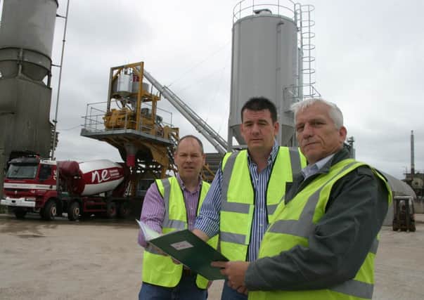 Pictured with the new Ready Mixed Plant at the Norman Emerson Group premises at Ardmore on the shores of Lough Neagh near Lurgan are, from left, Uel Parr, General Manager, Colin Emerson, Production Director and Conor Jordan, Business Development Manager, Norman Emerson Group. INLM34-012