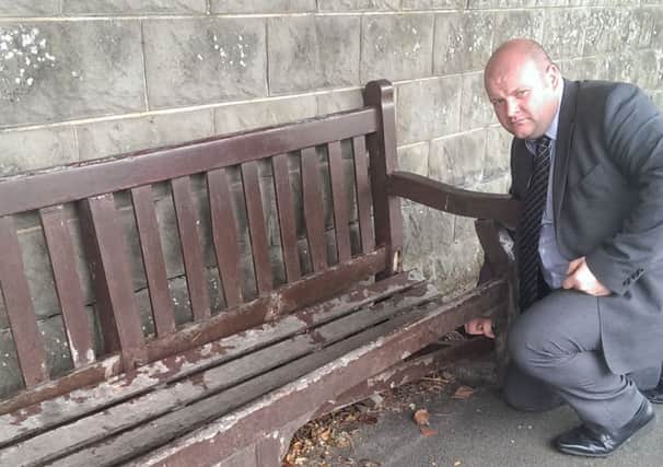 Mark Baxter surveys damage to the summer seats in Waringstown.