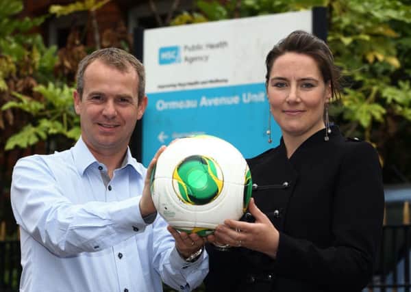 Geoff Wilson, Irish FA Head of Marketing and Communications and Amy Pepper, a Health and Social Wellbeing Improvement Senior Officer at the Public Health Agency pictured at the launch of the Irish FA Health Booklet and App.