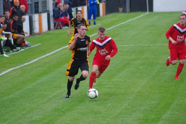 Jody Lynch on the ball for Carrick in Tuesday night's 4-2 win over Ballyclare Comrades.
