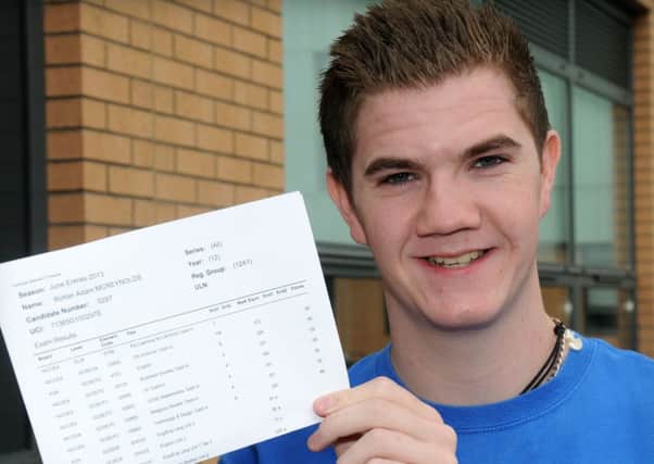 A delighted Magherafelt High School student Rowan McReynolds after receiving his GCSE results at Magherafelt High School last Thursday morning.INMM3513-301SR