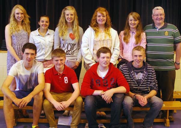 Top graded GCSE students from Slemish College joined by principal Dr. Paul McHugh for a celebration photograph. INBT 35-806H