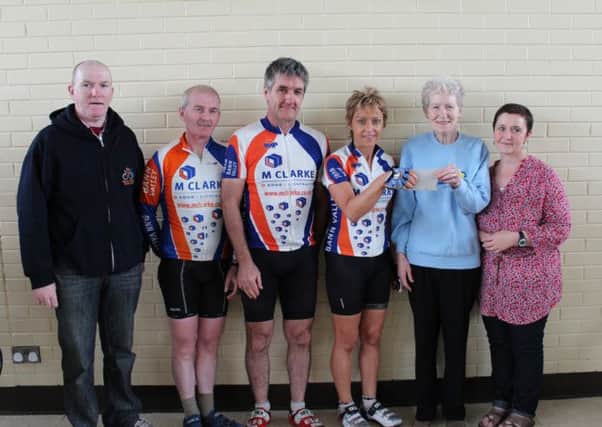 Marie Curie fund-raisers Mrs Ray Graham and Pauline McGoldrick receive a cheque for £3,000 from Christina Clarke, proceeds of the annual Bann Valley Road Club charity cycle. Also included are Laurance Maguire (chairman), Gerry McCullagh (treasurer) and Michael Clarke (club sponsor).