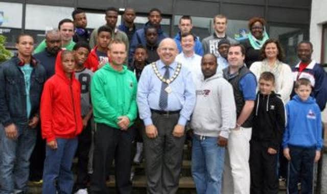 BOX CLEVER. Mayor Cllr John Finlay, pictured along with Alan 'Spike' Martin and members from Scorpion Boxing Club and boxers from Belfast Beltway Boxing Project including Tar McBride and President Manny Quinn.INBM34-13 412SC.