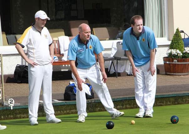 Ballymena bowlers Stephen and Alistair Coleman offer encouragement during Saturday's game against Belmont. INBT 35-912H