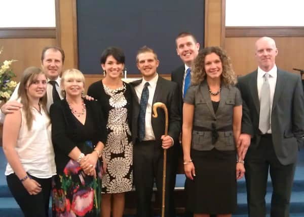 Stephen Silverson (fifth from left) at his ordination as pastor of Chelsea Community Baptist Church with, from left, his sister Tori Silverson, parents John and Sandra Silverson, fiance Julia Ostertag, outgoing pastor John Anderson and his wife Sara Anderson and Stephen Moore, who was Stephen's youth pastor in Carrickfergus. INLT 35-608-CON