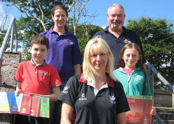 Kerry Fokkens, front,  from Larne Leisure Centre, who presented Rory McAuley and Katie McNally with Rookie Lifesaving Awards following a course organised by Larne YMCA in conjunction with Larne Leisure Centre and the Royal Life Saving Society. Included are Laura Hunter of Larne YMCA and Robin Bates, RLSS trainer assessor. INLT 35-625-CON