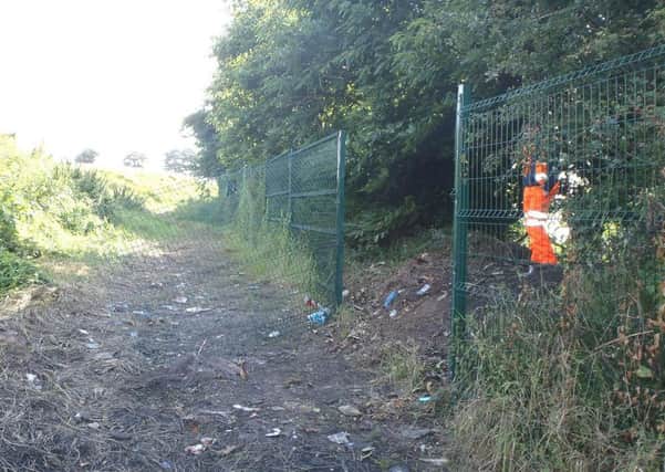 Damage to the railway fence, which has now been repaired.