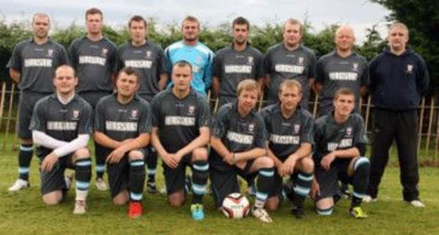 ON THE TILES. Pictured in their new strip, sponsored by TilePlus are players from Balnamore FC prior to their opening game of the season. Included is Secretary Geoffrey Wilmont.INBM34-13 013SC.