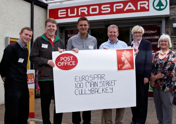 EUROSPAR staff Richard Reid, Stewart Harkin and Steven Barr officially welcomes the new Post Office along with post master Brian Nicholl, and post office staff Melissa Lamon and Doreen Lamont.