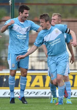 Allan Jenkins celebrates with team-mate Mark McCullagh after scoring against Dungannon on Saturday. Picture: Press Eye.
