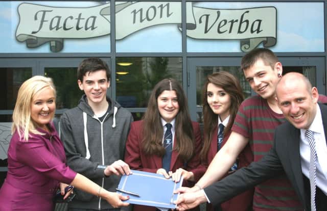 Mrs Gormley (principal) and Mr Brennan (assistant principal, upper school) with happy Year 12 pupils Fionn Crossan, Amy Garner, Hannah Beickhorasani and Reece Hendry at Hazelwood Integrated College. INNT 35-503CON