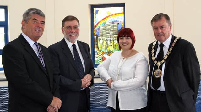 Councillor Billy Webb and Vicky Moore (centre manager) welcome Minister Nelson McCausland and Mayor Fraser Agnew to the Dunanney Centre. INNT 35-030-FP