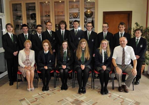 The Lismore Comprehensive School top achievers in the GCSE examinations. Included are, Mr Joe Corrigan, principal and Mrs Dolores Foster, vice principal. INLM35-103gc