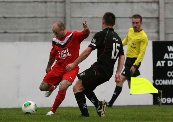 Ballyclare's Kyle Agnew gets a cross in during Monday's League Cup defeat against Glentoran.