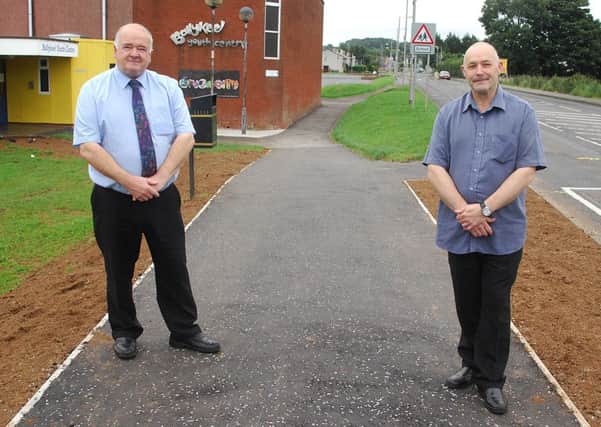 Councillor Martin Clarke and Roy Heron, Ballykeel Together Development Association inspect the newly moved foot-path leading to the Primary School. INBT 36-801H