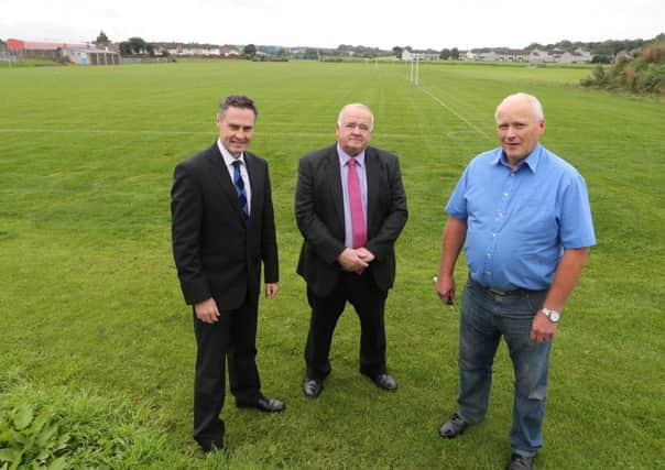 Paul Frew MLA and Cllr Martin Clarke with local resident and football fan Trevor Robinson at the new Wakehurst Playing Fields which they campaigned to get upgraded. INBT 25-185CS