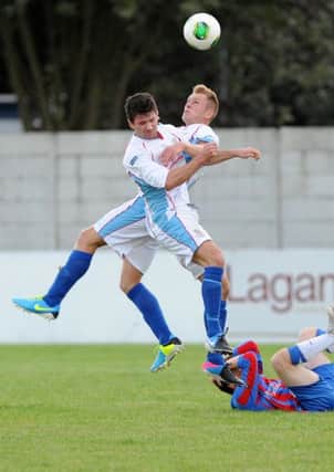 United defenders Mark McCullagh and Johnny Taylor get in a tangle against Ards. Picture: Press Eye.