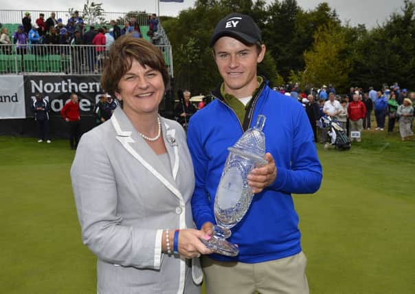 Daan Huizing from the Netherlands is presented with the trophy by Arlene Foster, Northern Ireland Minister for Enterprise, Trade and Investment, after winning the inaugural Northern Ireland Open at Galgorm Castle Golf Club. Picture: Press Eye.