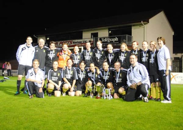 Dromore Ladies with all three of the cups they have won this season.