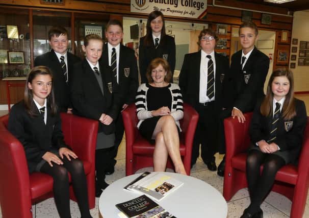 Principal of Dunclug College Mrs Wilson with a selection of the new Year 8 students who started the school last Thursday. INBT 36-108JC
