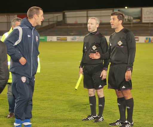 Oran Kearney has a post-match word with referee Andrew Davey