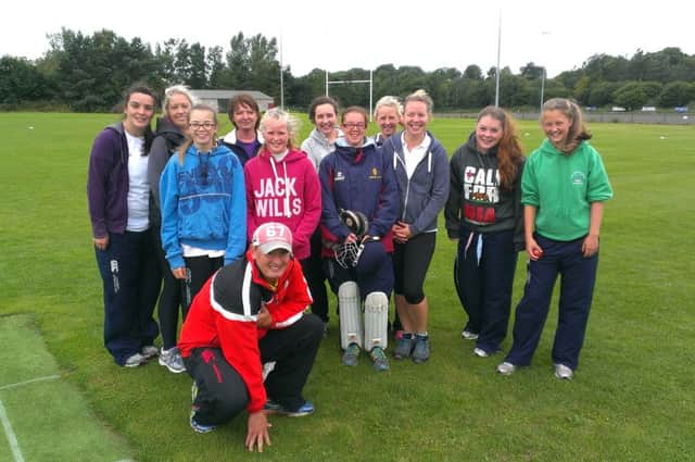 The Templepatrick Cricket Club ladies XI with coach Warren Clunes before their match against CIYMS.