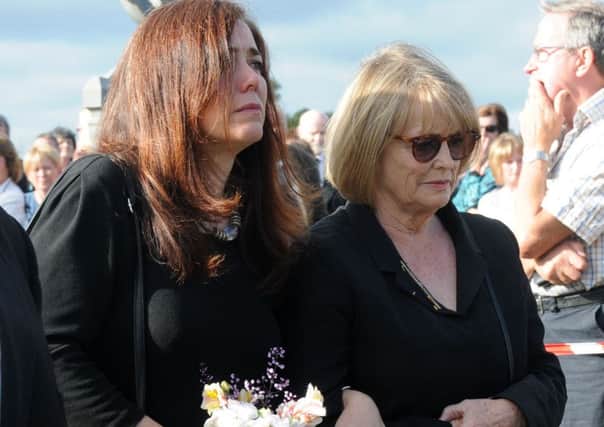 Marie Heaney and daughter Catherine arriving at the graveyard.