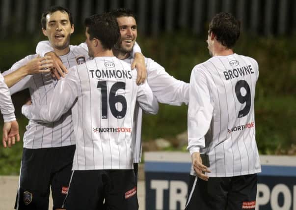 Coleraine's Michael Hegarty (left) celebrate as Stephen Carson gets their second goal at Cliftonville.