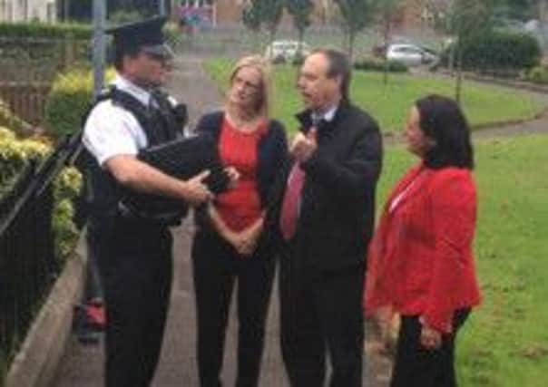 Nigel Dodds MP, Paula Bradley MLA (right) and Councillor Audrey Ball with PSNI Sergeant Colin Crymble during their site meeting in Glenvarna.