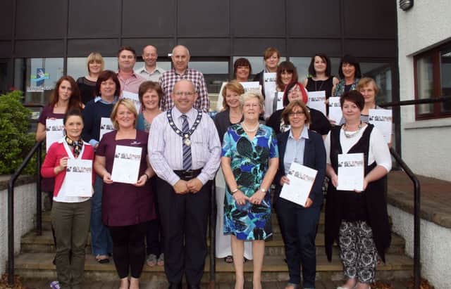 The Mayor of Ballymoney Councillor John Finlay and recipients of World Host Customer Service certificates presented at Riada House on Wednesday night. The presentations followed a two-day programme facilitated by by local World Host trainer, Jean Howarth (pictured) and endorsed by Ballymoney Council.INBM37-13 240L