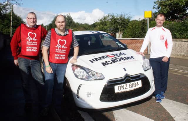 Ian McAfee (right) who is planning a sponsored run in aid of the British Heart Foundation from Ballymoney Showgrounds to Coleraine Showgrounds on September 21 with his sponsor, Ian Hamilton of Hamilton Academy, and Jimmy Walke, Lead Volunteer with the BHF.INBM37-13 272L
