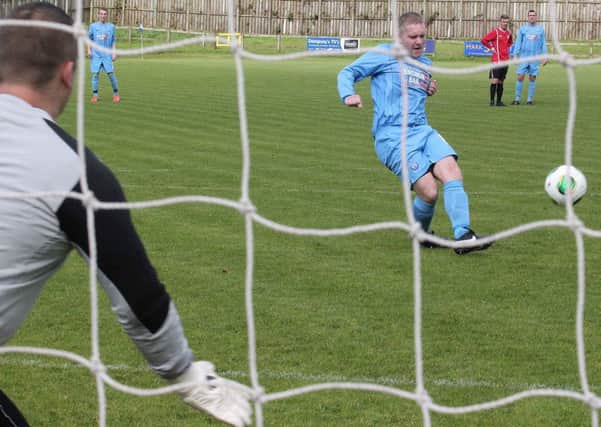 Portstewart striker Ricky Dunlop hits the net to make it 1-1 during the Championship two tie against Chimney Corner. INCR37-160MJ