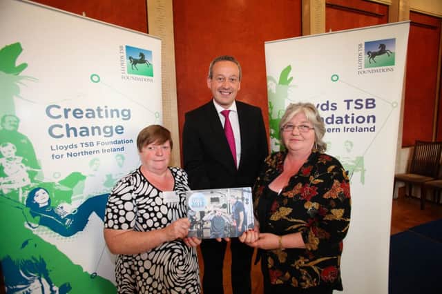 Patricia Murray and Wilma Lennox from Newtownabbey Women's Group are pictured at the event in Stormont with Lloyds TSB Foundation Trustee, Hugh Donnelly. INNT 37-505CON