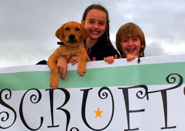 Anna and James with dog Billy preparing for the Most Handsome Dog competition at Scrufts,
