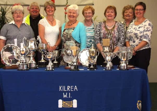 Committee members of Kilrea Wi pictured with guests at the annual flower show held in Kilrea Primary School. INCR37-133MP