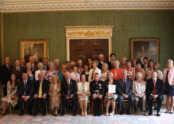 The Londonderry Musical Society receives the Queen's Award For Voluntary Service at Hillsborough Castle.